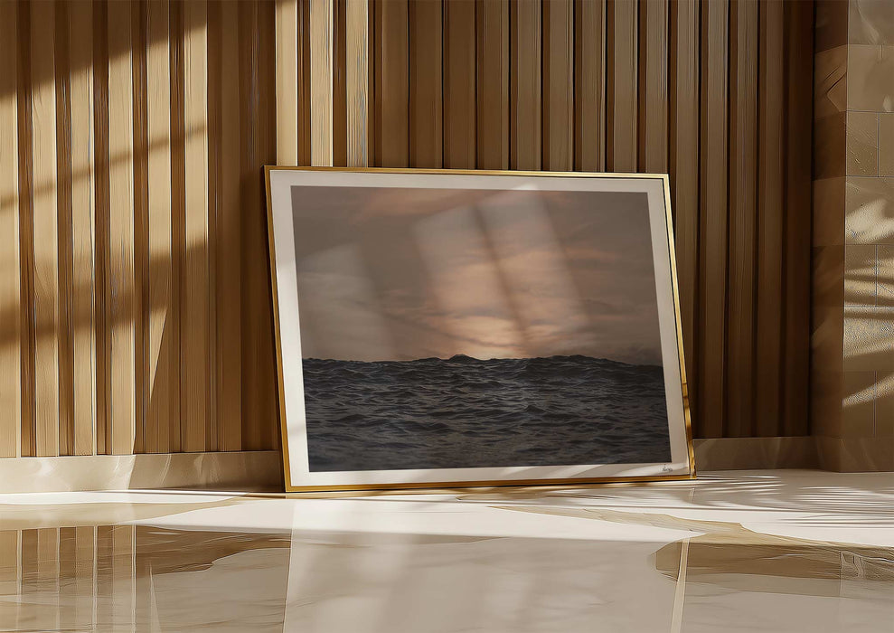 Crinkles With Colour, a framed colour print leaning against a wall depicting a peaceful ocean at Polzeath, Cornwall.
