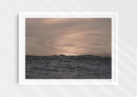 Crinkles With Colour, a colour photographic print of a peaceful ocean at Polzeath, Cornwall in a white frame.
