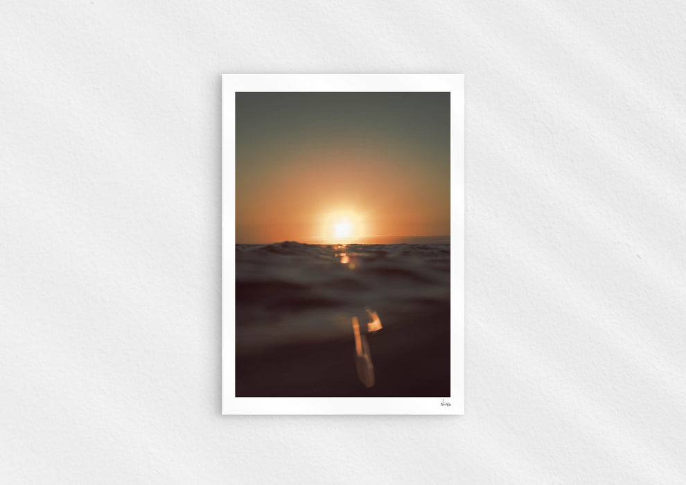 Gold Stripe, a colour photographic print of the sun at the ocean horizon at Croyde Bay, Devon.
