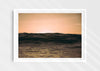 Light Life, a colour photographic print of dusk over calm ocean at Woolacombe, Devon in a white frame.