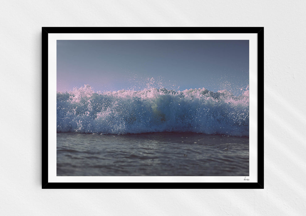 Moments With Colour, a colour photo print capturing a surfer’s eye view of the paddle out at Polzeath in a black frame.