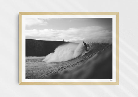 Nowhere To Hide, a black-and-white photo print of a surfer on a wave in Porthtowan, Cornwall in a wood frame.