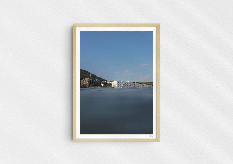 Sea With Hotel Views, a colour photographic print of Saunton Sands Hotel shot from the sea in a wood frame.