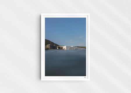 Sea With Hotel Views, a colour photographic print of Saunton Sands Hotel shot from the sea in a white frame.