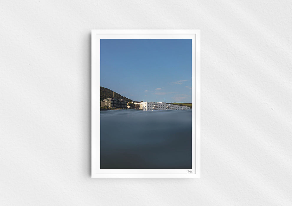 Sea With Hotel Views, a colour photographic print of Saunton Sands Hotel shot from the sea in a white frame.