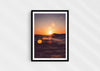 Solar Flare, a colour photographic print of sunlight on the ocean at Porthtowan, Cornwall in a black frame.