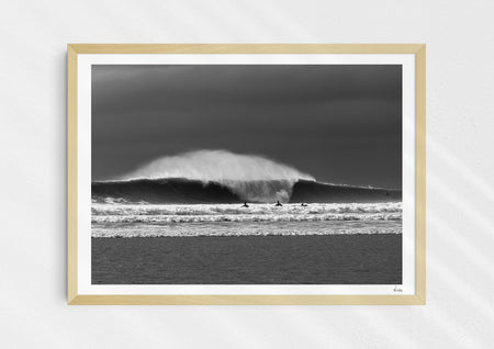 Untamable, a fine art photographic print depicting a barrelling wave with spray at Croyde Bay in Devon in a wooden frame.