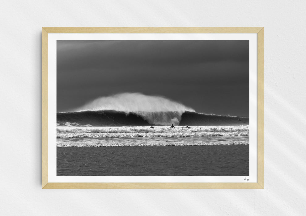 Untamable, a fine art photographic print depicting a barrelling wave with spray at Croyde Bay in Devon in a wooden frame.