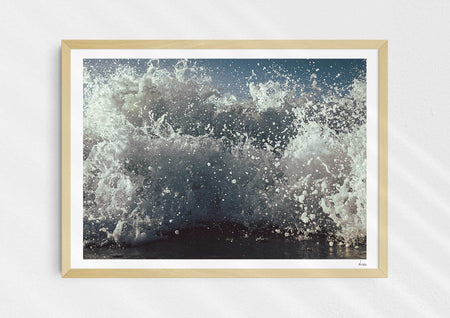 What We Sea, a colour photograph of white water from a sea-level perspective in a wood frame.