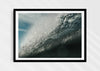 Wild Seductive, a colour photographic print of water droplets suspended over a wave in the Azores in a black frame.