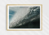 Wild Seductive, a colour photographic print of water droplets suspended over a wave in the Azores in a wood frame.