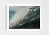 Wild Seductive, a colour photographic print of water droplets suspended over a wave in the Azores in a white frame.
